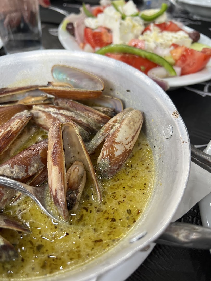 Portion of deep-fried seafood served on a white platter ready to be served.